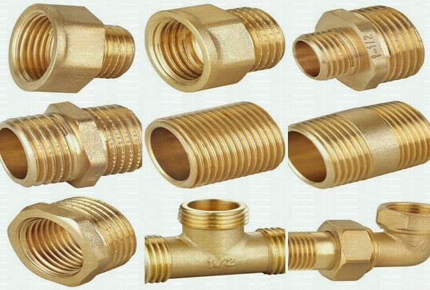 Brass PPR pipe fittings including elbows, tees, and threaded connectors for plumbing systems